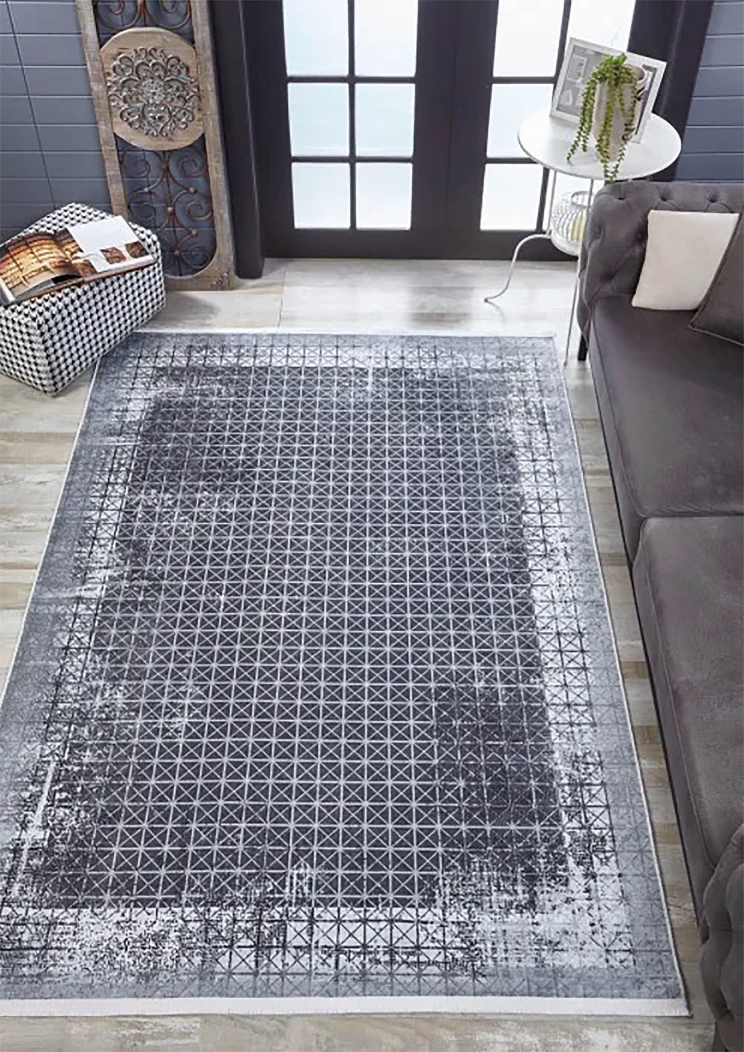 Geometrischer schwarzgrauer Teppich