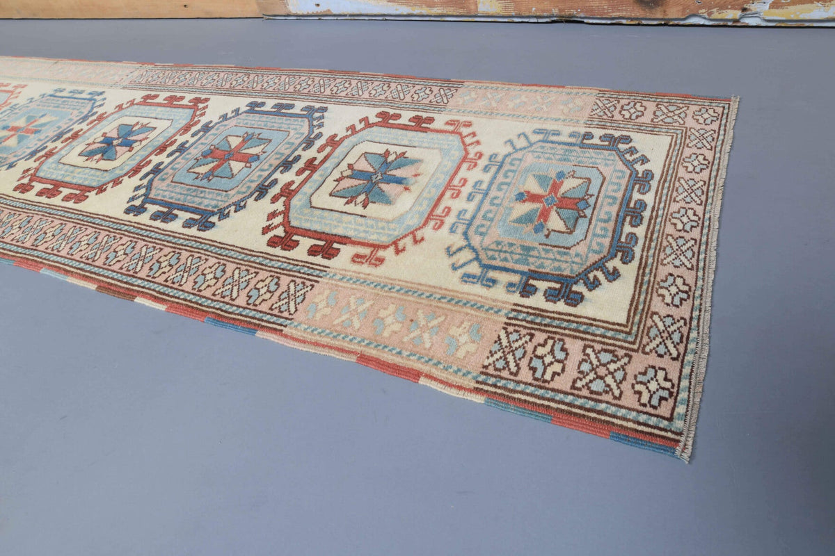 El yapımı vintage yolluk 74x244 cm bordürlü desenli yün - yakın çekim doku detayı