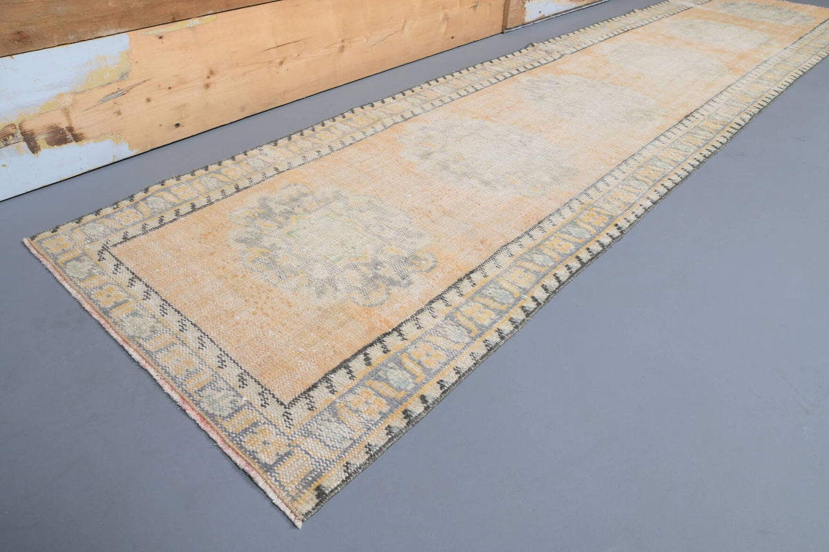 El yapımı vintage yolluk 76x315 cm bordürlü desenli yün - yakın çekim doku detayı