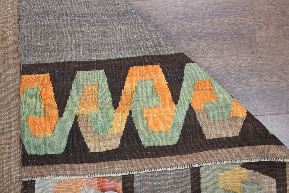 Kilim motifli el dokuma vintage kilim – turuncu ve kahverengi tonlarda yün dokuma