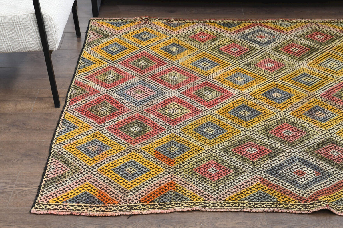 Ikat desenli el dokuma vintage kilim – turuncu ve sarı tonlarda yün dokuma