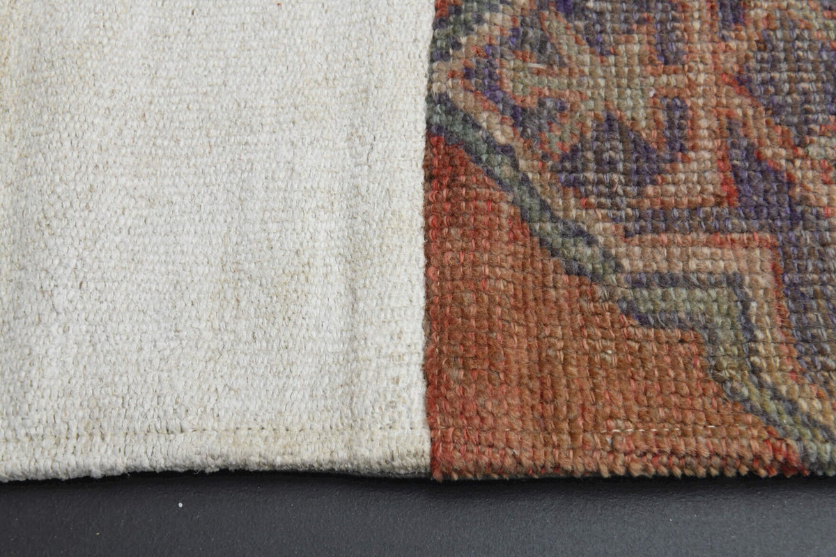 El yapımı vintage halı 196x279 cm i̇kat desenli yün - yakın çekim doku detayı