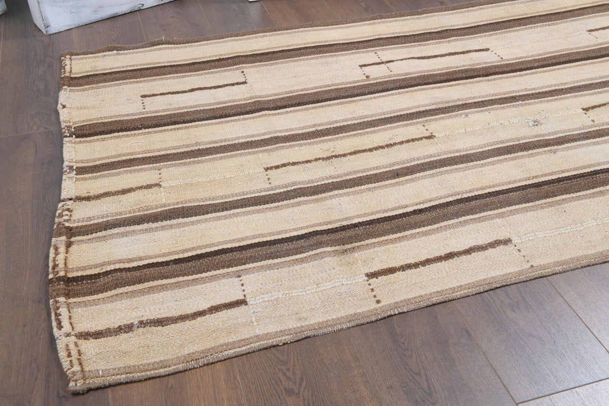 Ikat desenli el dokuma vintage kilim – turuncu, bej ve kahverengi tonlarda yün dokuma