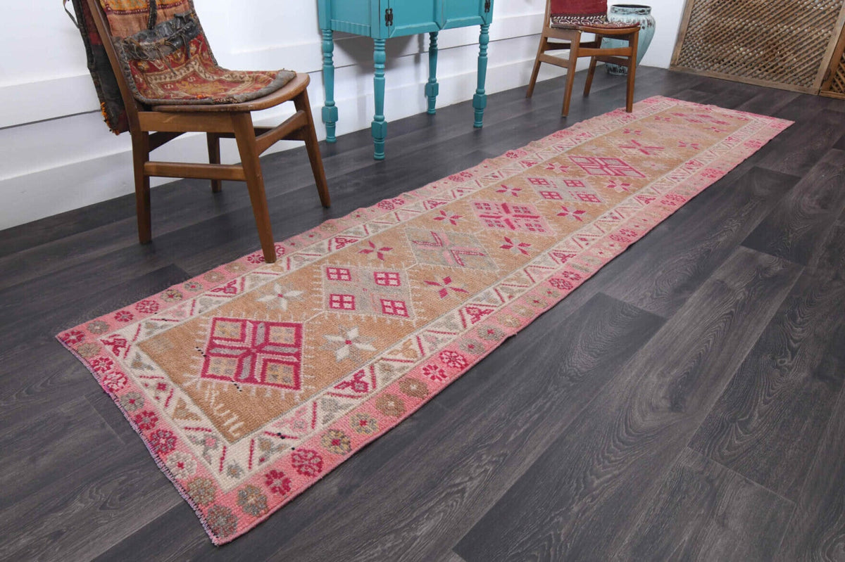 Ikat desenli el dokuma vintage yolluk – turuncu ve pembe tonlarda yün dokuma