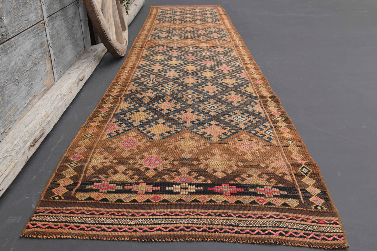 Ikat desenli el dokuma vintage yolluk – turuncu ve kahverengi tonlarda yün dokuma