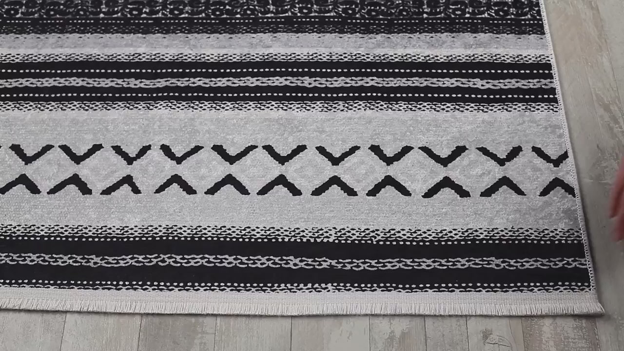 Video laden: Weiß und schwarz gestreifter Vintage-Teppich