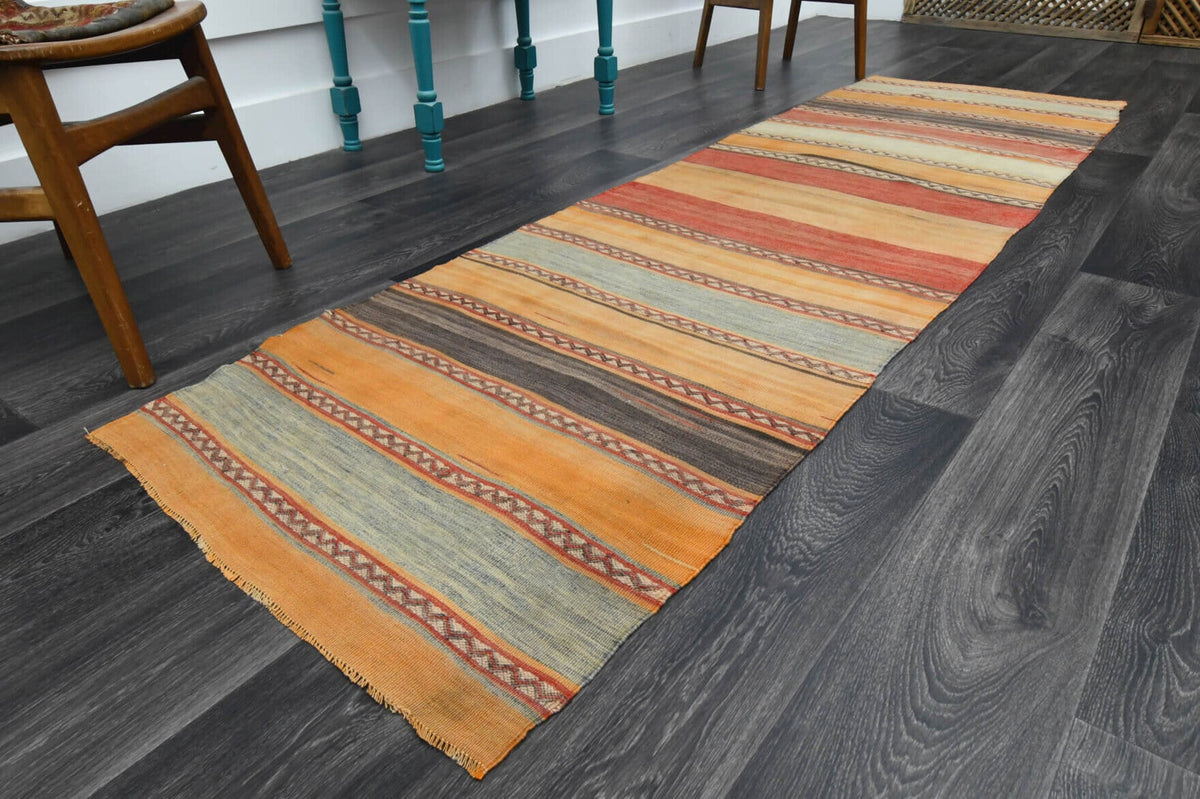 Oryantal desenli vintage kilim yolluk – turuncu ve kırmızı tonlarda yün dokuma