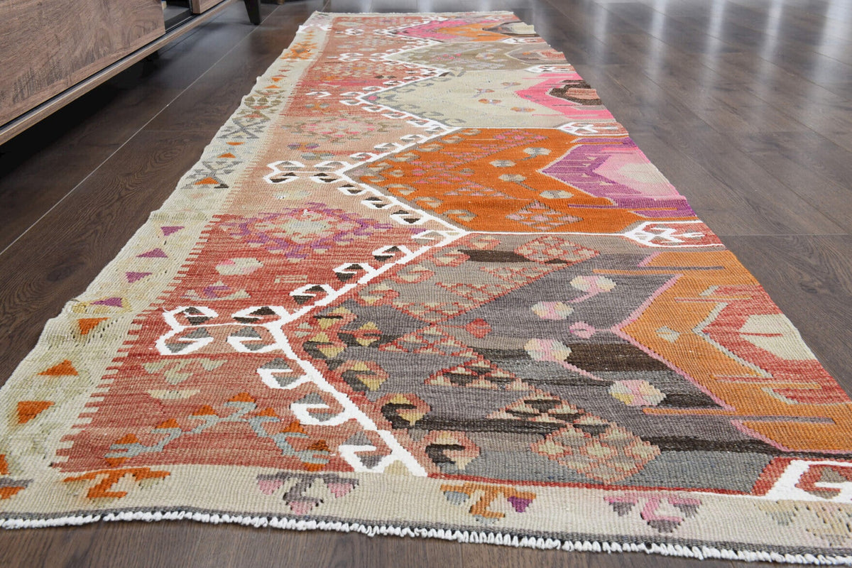 Oryantal desenli vintage kilim yolluk – turuncu, bej ve pembe tonlarda yün dokuma