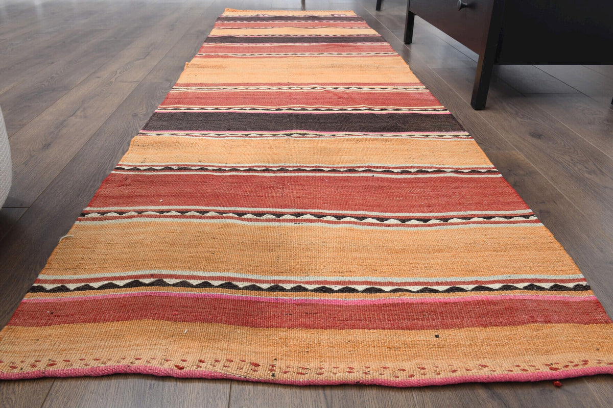 Çizgili vintage kilim yolluk – turuncu ve kırmızı tonlarda yün dokuma