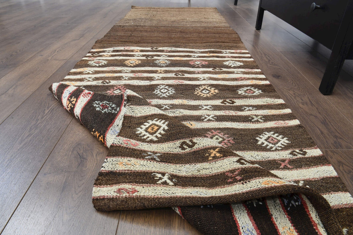 Ikat desenli vintage kilim yolluk – kahverengi ve turuncu tonlarda yün dokuma