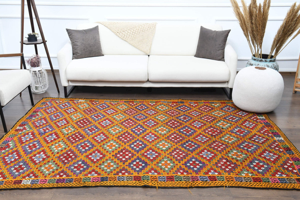 Vintage kilim 177x256 cm – turuncu ve kırmızı ikat desenli, el dokuma