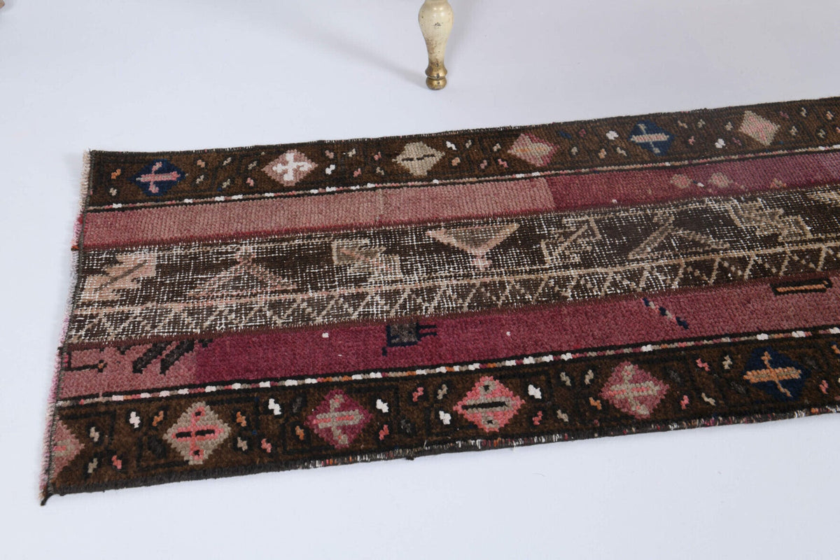 Ikat desenli patchwork vintage yolluk – kahverengi, beyaz ve kırmızı tonlarda yün dokuma
