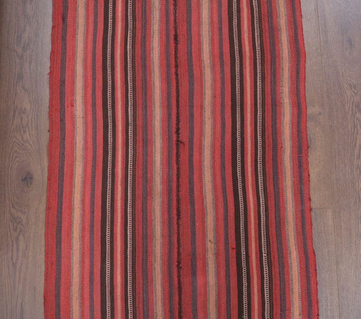 Çizgili vintage kilim yolluk – kırmızı tonlarda yün dokuma