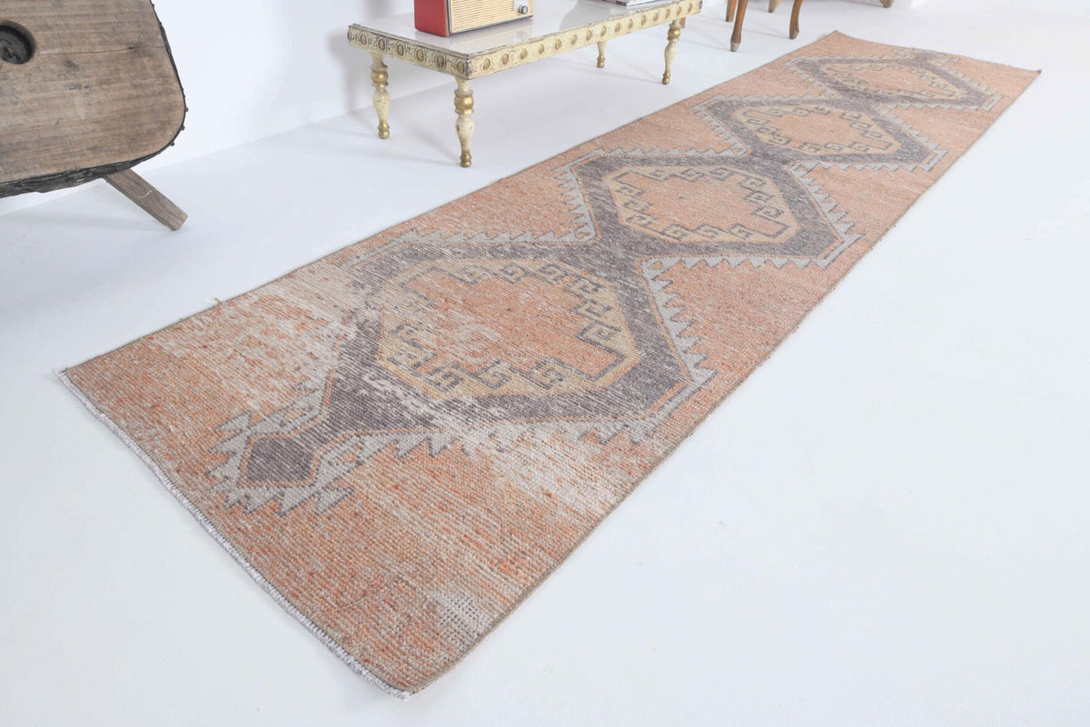 Geometrik desenli el dokuma vintage yolluk – turuncu tonlarda yün dokuma